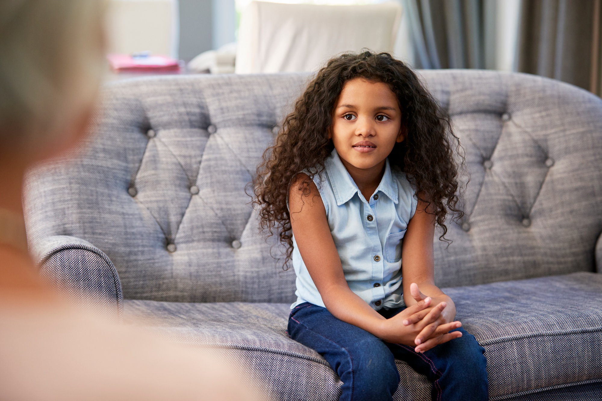 Young girl having therapy with a child psychologist